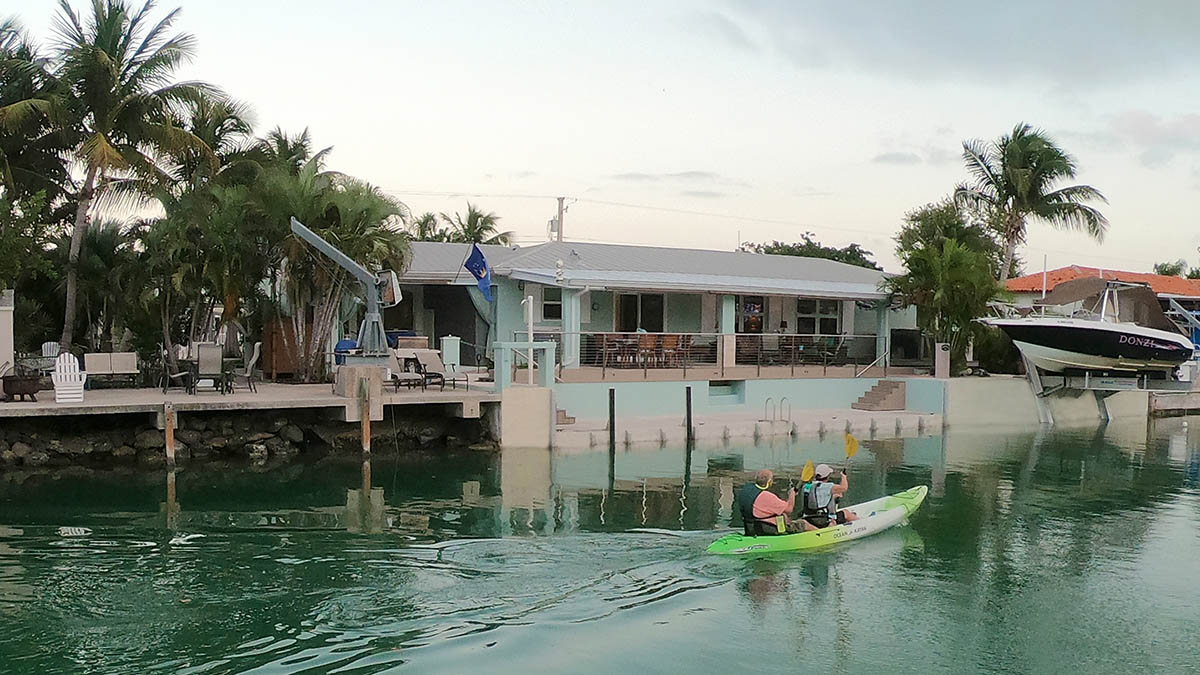 120' wide Waterfront off a 10' deep ocean side canal features outdoor living and dining areas, large outdoor deck only 10 feet from the water, plenty of room for your boats, and good snorkeling along the edge.  Marina is located at the end of our canal
